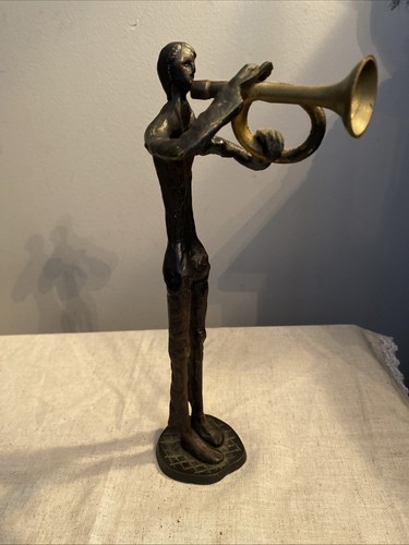 Vintage cast iron man - iron, playing