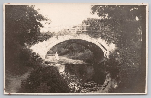 Rppc stone arch bridge girl - rppc,
