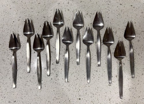 Twelve mid century stainless - mid,
