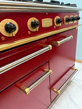 FALCON 110CM DUAL FUEL RANGE COOKER IN RED AND BRASS. Ref--ED261