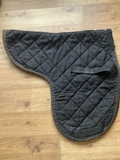 Black with brown trim showing Numnah  pony size straight cut 