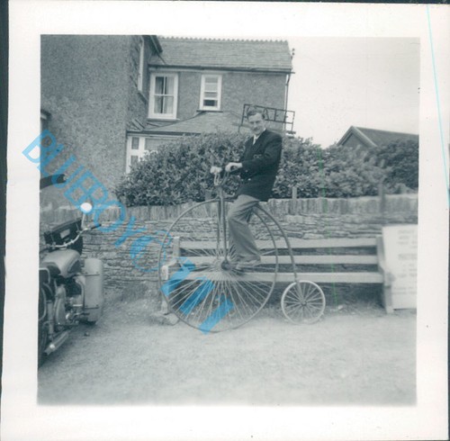 Man penny farthing bicycle - man,