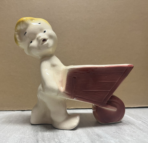 Vintage ceramic boy pushing - ceramic-boy,