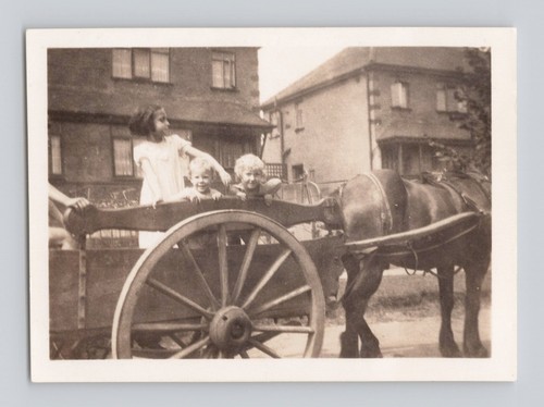 Old photo children riding - old,