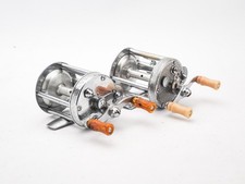 PAIR OF PFLUEGER BAITCASTING