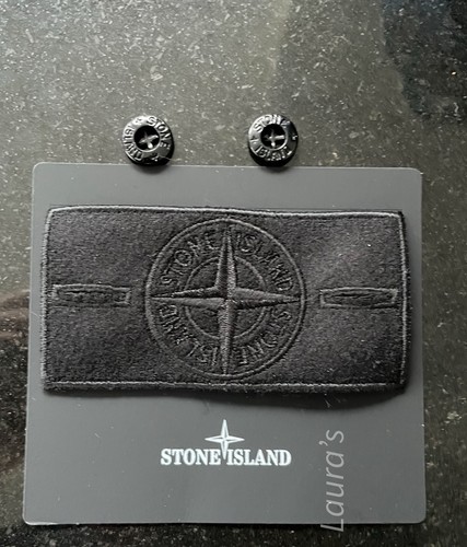 The stone island badge with - the,