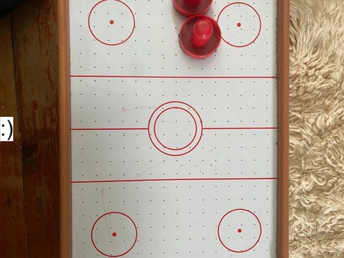 Red and white air hockey - , table