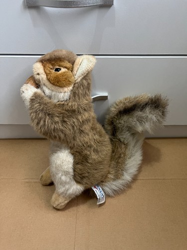 2010 hansa squirrel holding - 2010, a