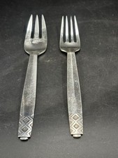 A pair of Danish-designed Georg Jensen sterling silver (925) dessert forks