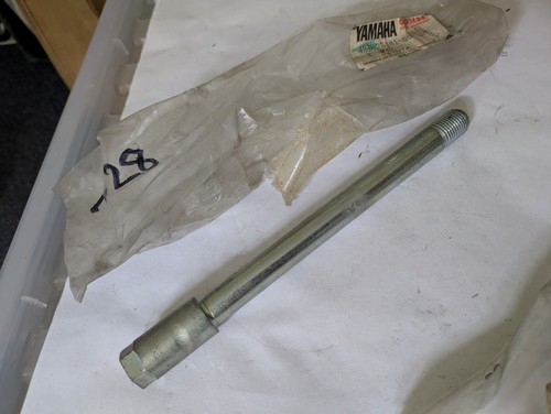 Yamaha front wheel spindle - front,