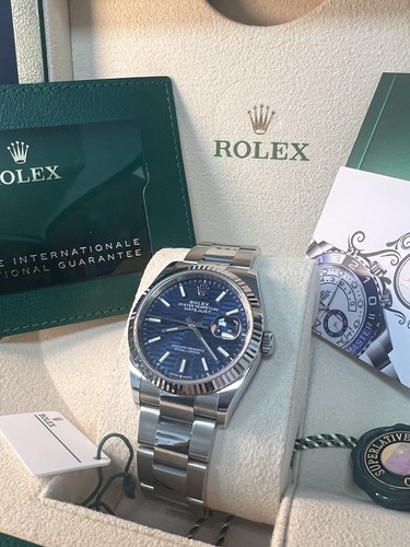 Unworn rolex blue motif - unworn,