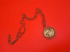 9 carat gold pendant and 20