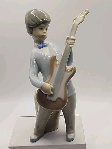 Retired vintage lladro guitar - retired,
