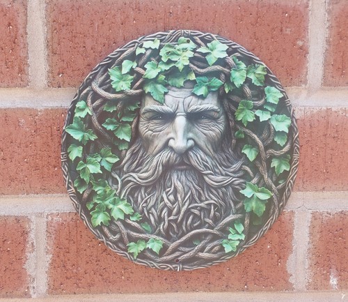 Leafy green man face plaque - face,