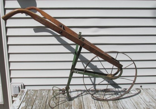 Antique boy scout cultivator - boy,