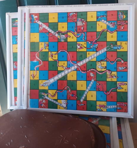 Snake ladder board with - &,