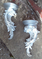 a pair of wall cobels silver