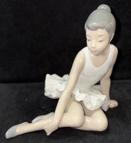 Nao lladro seated - by, "seated