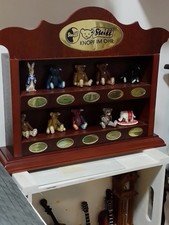 shelf of pewter steiff bears