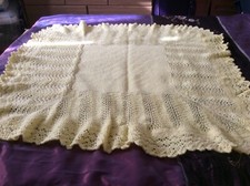 Hand knitted baby shawl in double knit baby wool.