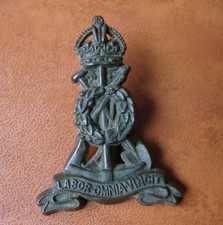 Original WW2 plastic economy Pioneer Corps cap badge with blades.