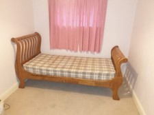 Solid wood sleigh bed single with deep mattress. Good condition. 