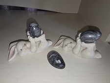 Two Adorable White Resin Spring Easter Bunny Rabbits Figurines Holding Eggs.