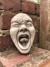 Scream yawn face garden stone