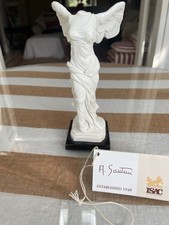 Small Roman Statue On Marble