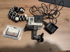 GoPro Hero 3+, with waterproof case, mini tripod, charger.
