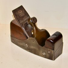 A 7 1/2" IRON BASE BRASS LEVER