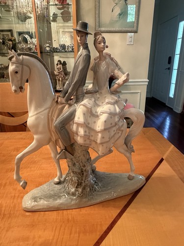 Lladro couple riding - a,