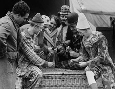 Clowns and other members of the Bertram Mills Circus enjoy a game - Old Photo