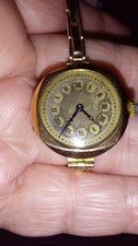 Vintage 9ct gold cased ladies watch with a rolled gold strap in working order