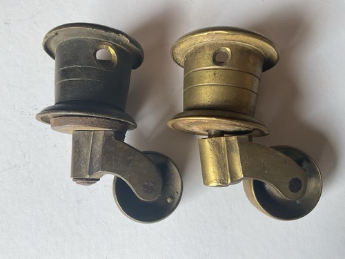 Two antique brass castors - antique,