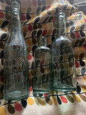 . 3 vintage bottles.green glass