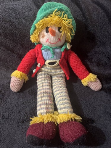 Handknitted scarecrow soft toy
