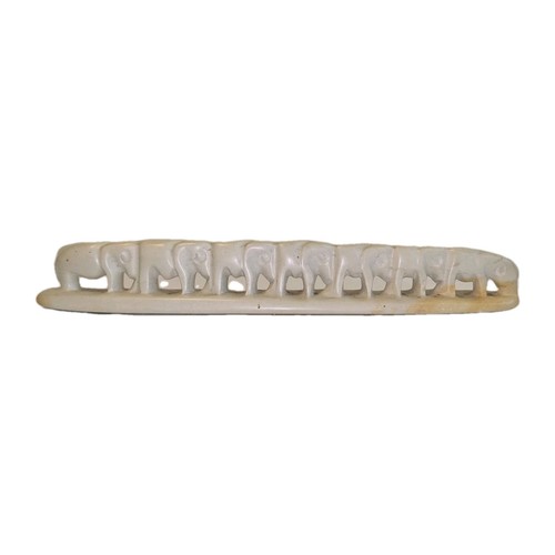 Hand carved soapstone line - line, of
