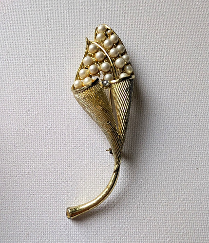 Gold tone faux pearl