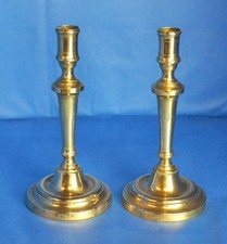 A fine pair of late Victorian brass candlesticks with detachable bases. 24cms.