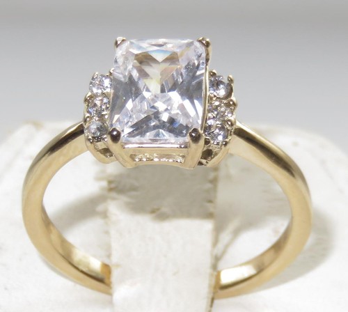 Ladies gold emerald cut ring