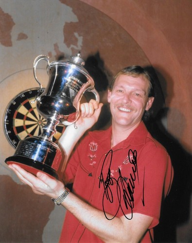 Bob anderson lifts the trophy - bob,
