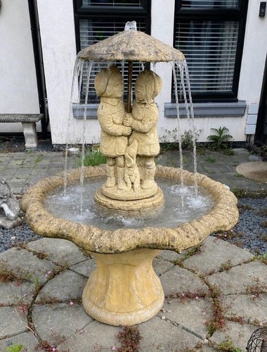 Stone water feature boy girl - stone,