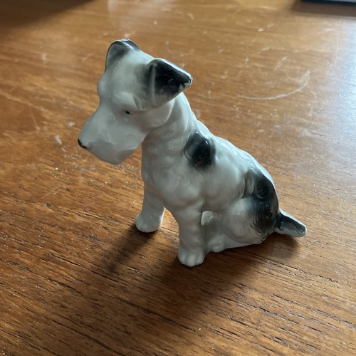 Porcelain figurine sitting - porcelain,