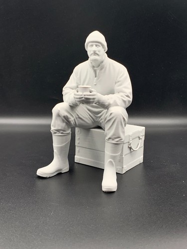 Crew figure sitting with - sitting, cup