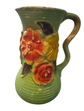 Vintage Pottery Jug Featuring Ribbed Body With Raised Hand Painted Floral Design