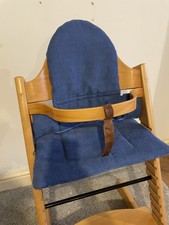 stokke tripp trapp wooden adjustable high chair with blue cushions