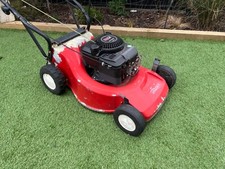 Petrol lawn mower self