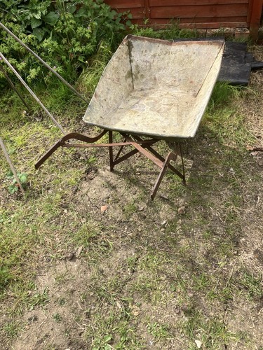 Old metal wheelbarrow - old,
