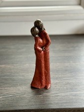 Genesis Heredities Fine Arts bronze sculpture of an embracing couple